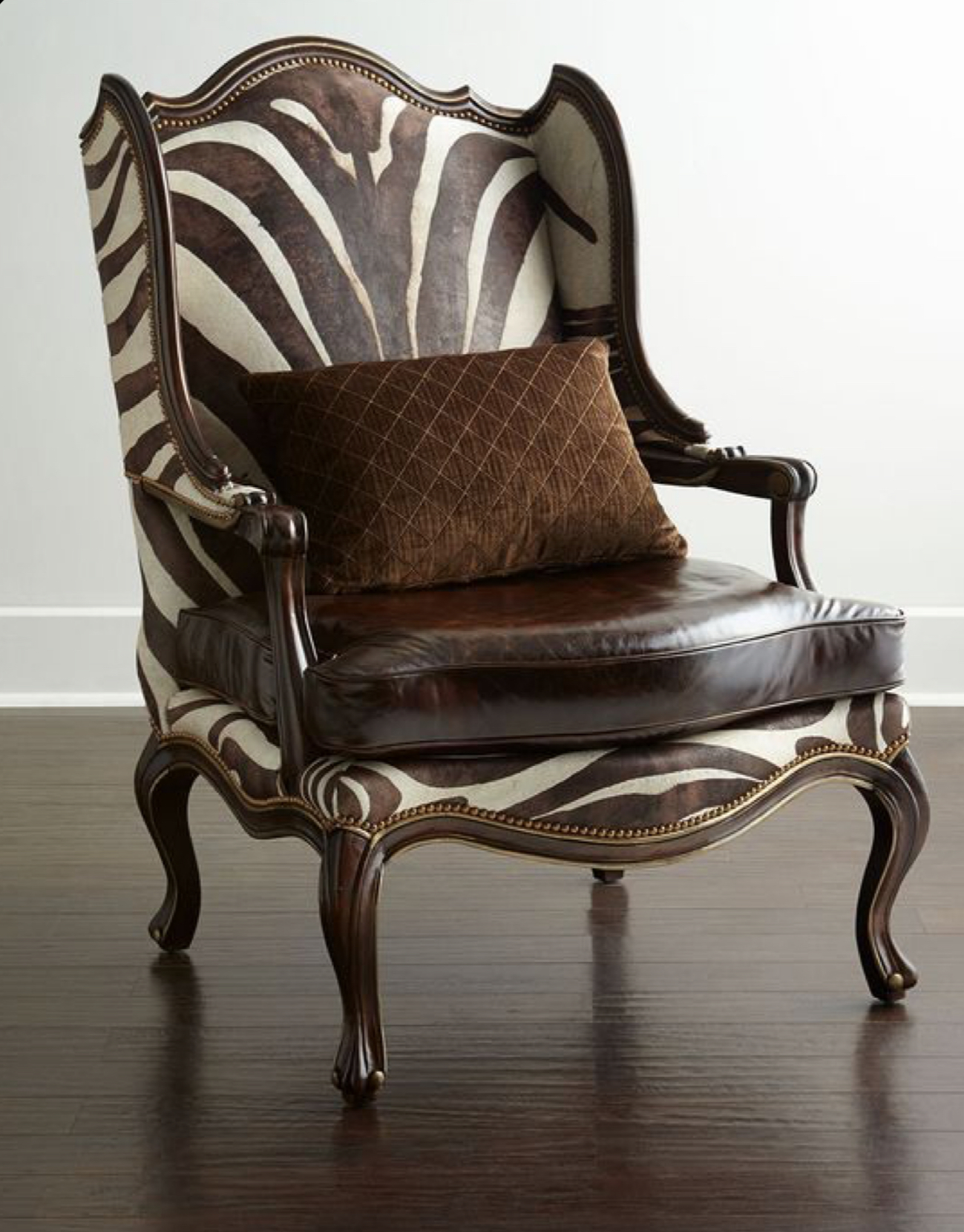 Fauteuil tapissé cuir et tissu imprimé